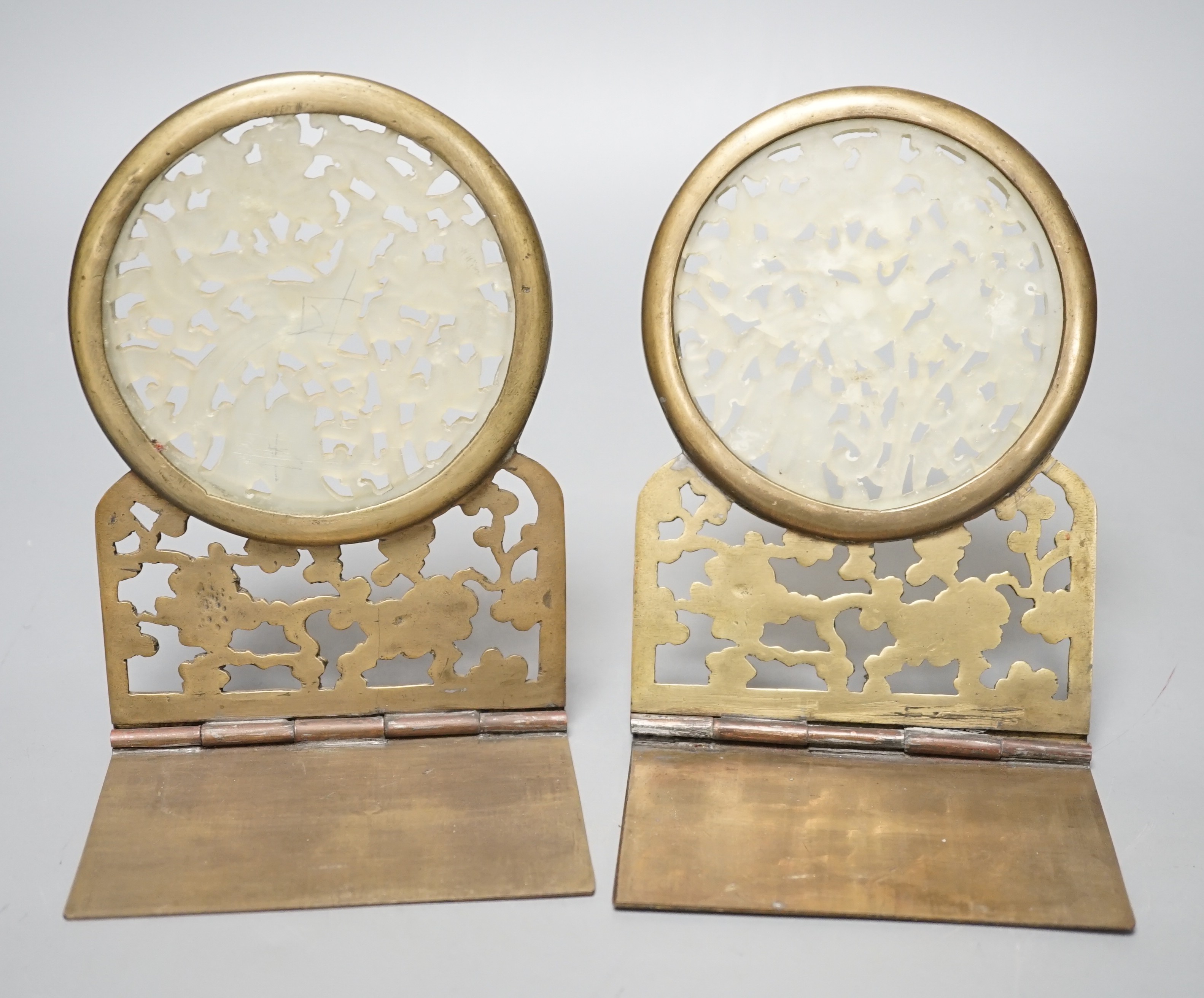 A pair of early 20th century Chinese bowenite jade mounted brass bookends 16cm tall